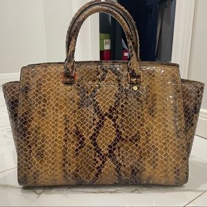 Michael Kors embossed leather crossbody medium sized bag.